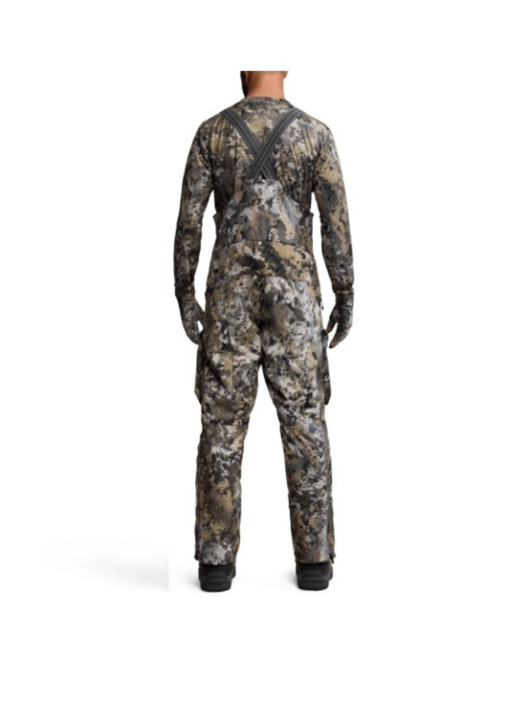 Fleece hunting cargo pants made of polyester synthetic fabric, warm and durable with camouflage pattern.